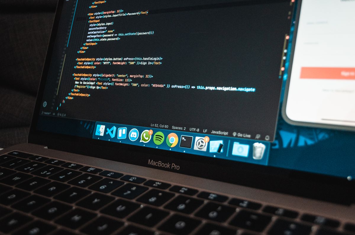Laptop showing code on screen — representing AI agent programming
