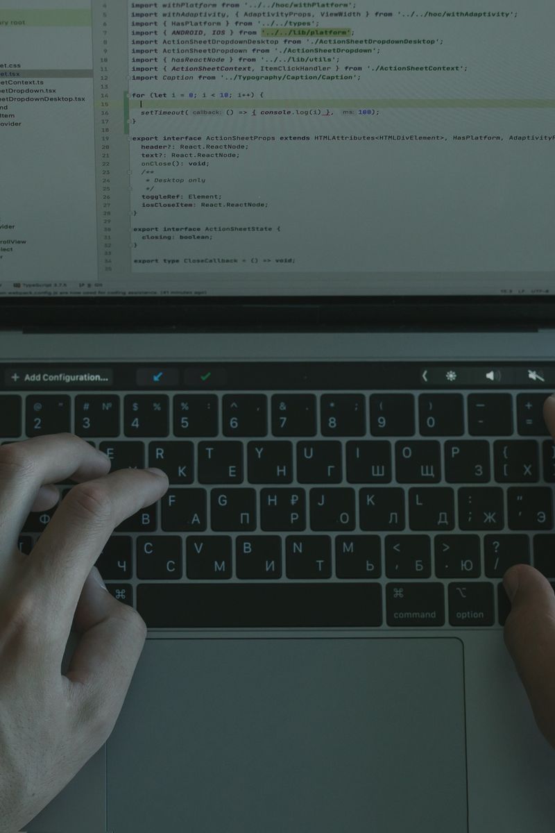Hands typing on a laptop — representing automated invoice processing